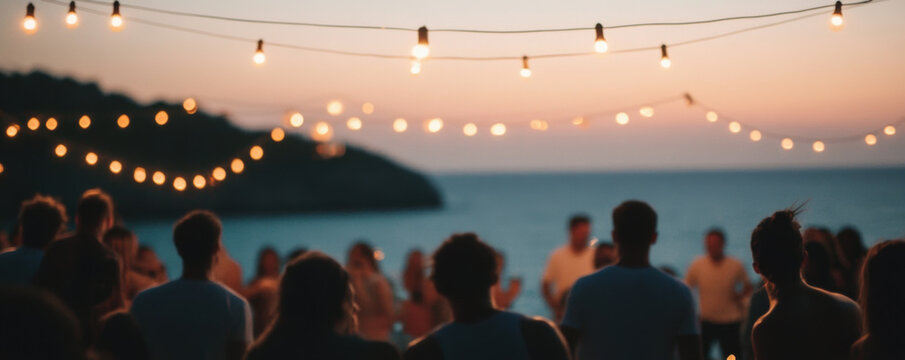 Lively ocean party at dusk with glowing string lights illuminating scene, creating festive atmosphere. People gather, enjoying beautiful sunset and vibrant energy