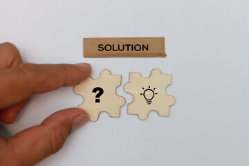 Letters of the alphabet with the word solution problem and solution icon completing final puzzle