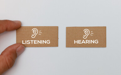 Between the words hearing and listening choose listening concept of choosing to listen than just her