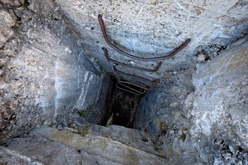 Fort Luserna, Austro-Hungarian historical site of the Great War: searchlight well and sailor's ladders. Luserna, Trentino, Italy.