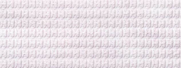 Texture of white soft velour textile with ribbed pattern, macro. Structure of plush fabric material...