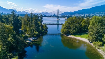 The Lions Gate Bridge, a famous landmark, goes over the water close to Stanley Park in Vancouver, Canada.

