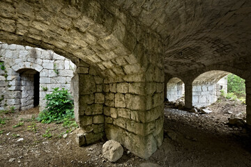 Obraz premium Fort Brusafer, Austro-Hungarian historical site of the Great War: interior of the caponier with the embrasures for machine guns. Trentino, Italy.