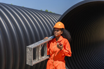 Industry Engineers Walking Inside Circular water Pipe. Engineering or Worker inspection pipe...