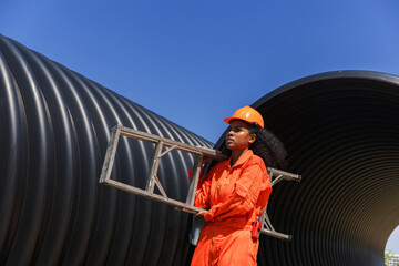 Industry Engineers Walking Inside Circular water Pipe. Engineering or Worker inspection pipe...