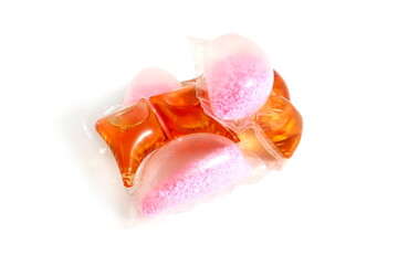 Two capsules of liquid powder lie on a white background.