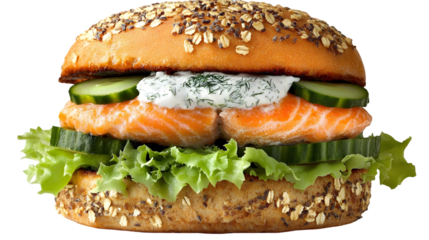 A salmon burger with lettuce cucumber and dill sauce on a bun on transparent background png