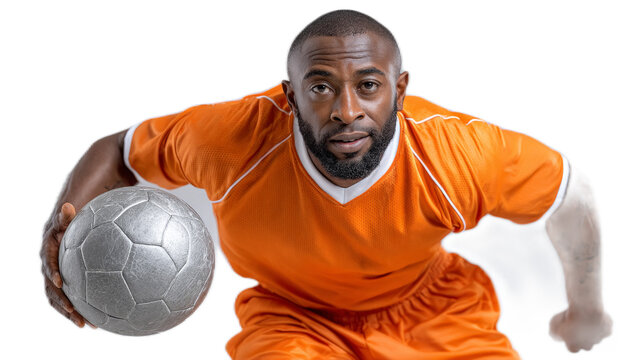 Soccer Player with Ball: A determined soccer player, a man with a serious expression, in an orange jersey confidently controls a silver soccer ball. Ready for action. - Powered by Adobe