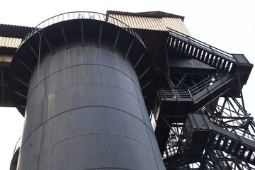 Industrial blast furnace with intricate metal structures against the sky in Starachowice in Poland