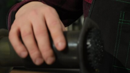 Man in shirt removes top of mixing apparatus shaking on edge. Bartender finishes mixing drinks filling off excess moisture slow motion