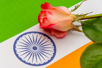 Emotional image: a rose on the tricolour of India, suitable for Independence Day, Republic Day and memorial themes.