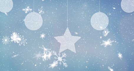 Drifting star and sphere swirl ornaments floating over blue gradient backdrop, falling snowflakes