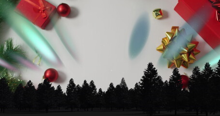 Displaying pine tree silhouette forming horizon on white backdrop, with gift boxes and baubles © vectorfusionart