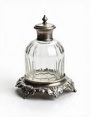 Isolated antique glass inkwell with ornate silver lid and base on white background

