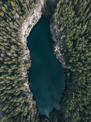 Drone photo of Syrjä Lagoon in Finland, captured from above. The deep blue water is surrounded by...