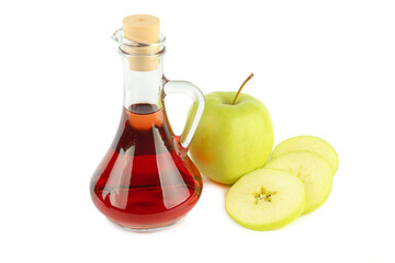 Apple vinegar in a bottle and fresh apples isolated on a white