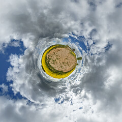 simple little tiny planet without buildings in blue sky with sun and beautiful clouds....