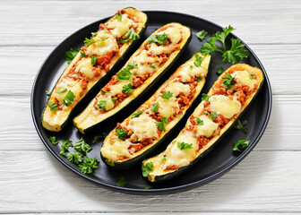 stuffed zucchini boats filled with bolognese sauce