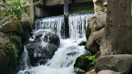 small artificial waterfall in the park