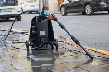 Abandoned Pressure Washer on City Street