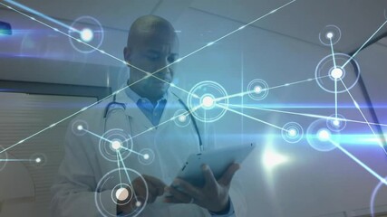 Doctor tapping tablet opening health data network while expanding holographic nodes for analysis - Powered by Adobe
