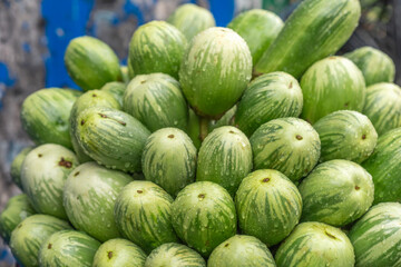 A pile of fresh green eggplant. eggplant, (Solanum melongena), tender perennial plant of the...