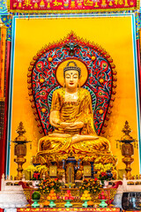 Obraz premium Colorful Golden Buddha statue, Temple of Great Compassion, Tianjin, China. Built in the 1600's it is the oldest Buddhist Temple in Tianjin.