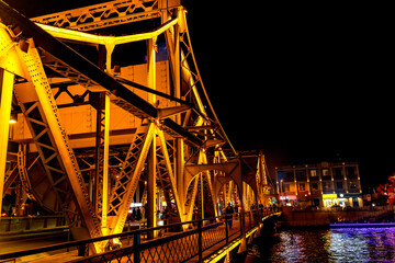 Colorful Jiefang Liberation Bridge, illuminated Hai River, Tianjin, China. Built in 1927....