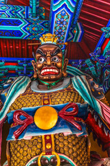 Colorful entrance guardian Statue, Tianhou Temple, Guwenhua Jie, Tianjin, China. Temple for Sea Goddess Mazu to pray for safety of navigation. Temple first created 1326 in Yuan Dynasty.