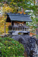 Small wooden shrine in the forest, Hida No Sato, Hida Folk Village, Takayama, Japan