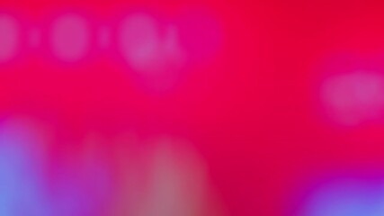 Colorful blurred video background of a music concert stage with flashing lights. Abstract motion with vivid hues of blue, pink, red, and green creating a dynamic atmosphere. Real time 4K Video. - Powered by Adobe