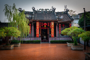 Traditional Chinese Temple Decorated with Red Lanterns and Banners in Bangkok, Thailand