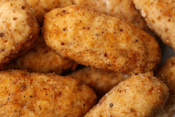 Tasty fried croquettes as background, closeup view