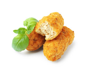 Tasty fried croquettes and basil isolated on white