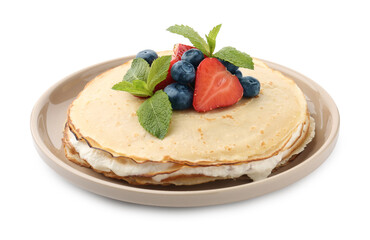 Delicious crepes with berries, cream and mint isolated on white