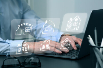 Real estate agent looking for housing via laptop at table, closeup. Illustrations of different...