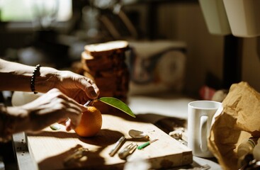 In a cozy kitchen, a skilled pastry chef meticulously arranges vibrant ingredients and decorations for cozonac, embodying the art of traditional baking and food styling