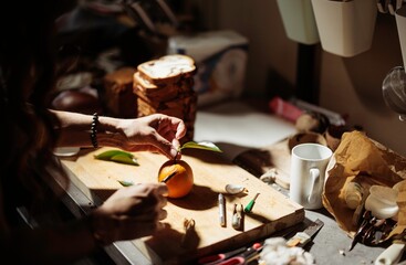 In a cozy kitchen, a pastry chef artfully decorates cozonac with fresh ingredients and vibrant colors. The rich aroma of baking fills the air as culinary creativity unfolds