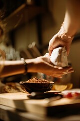 Hands are skillfully preparing cozonac decorations in a warm, inviting kitchen filled with colorful ingredients. The rich textures and aromas create a captivating baking atmosphere