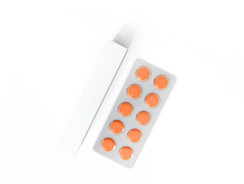 A blister pack of orange tablets next to an empty box, indicating medication or supplements.
