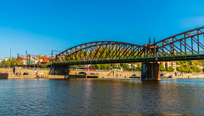 A view from the Vltava river across the Vysehrad Railway Bridge in Prague in springtime