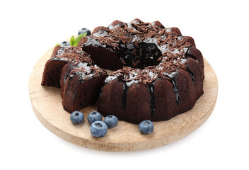 Delicious bundt cake with blueberries and chocolate shavings isolated on white