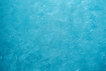 Naklejka premium Blue wall with rough plaster texture and mottled grunge surface