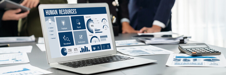 Panorama shot analyst team utilizing BI Fintech to analyze financial report with laptop....