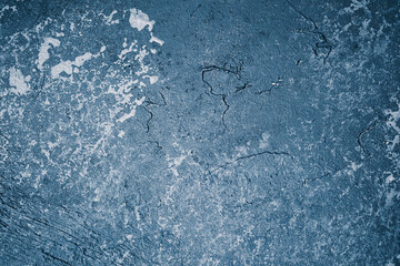 Grunge blue wall with textured plaster and worn vintage finish