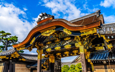 Fototapeta premium Colorful ornate entrance Karamon Gate, Nijo Castle, Kyoto, Japan. Completed in 1626 by Tokugawa Shoguns. Chrysanthemum is a symbol of Imperial Court.