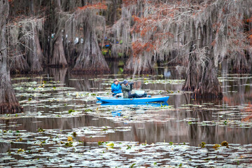 swamp photographer in boat
