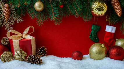 New Year red background with a Christmas tree, toys and cones