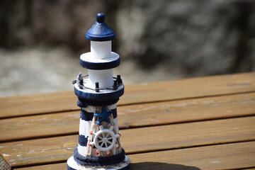 porcelain lighthouse figures on a wooden surface in Gdansk © MARIA – Nature