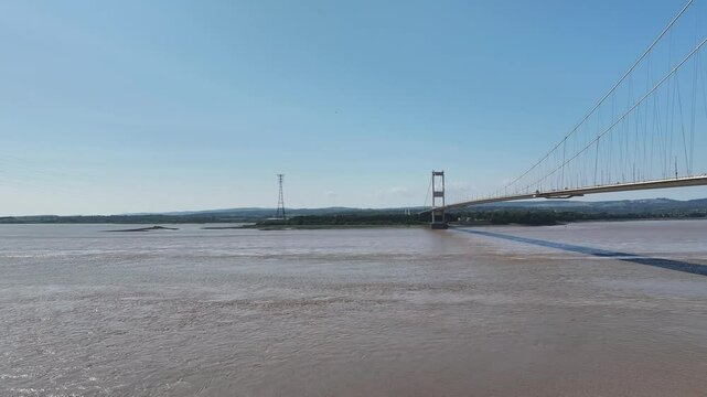 The M48 Severn Bridge between England and Wales. Wide transverse flight L to R